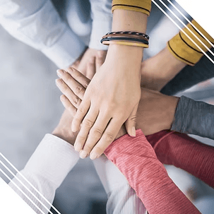Diverse hands stacked together teamwork business