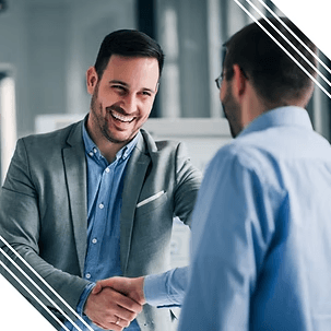 Businessmen shaking hands smiling agreement